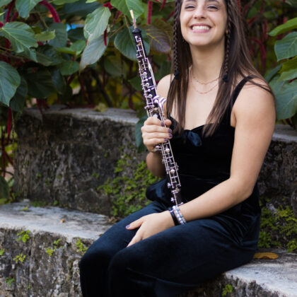 musician, female, sitting with oboe