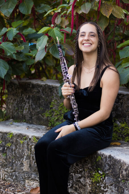 musician, female, sitting with oboe