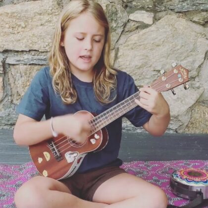 child with ukulele