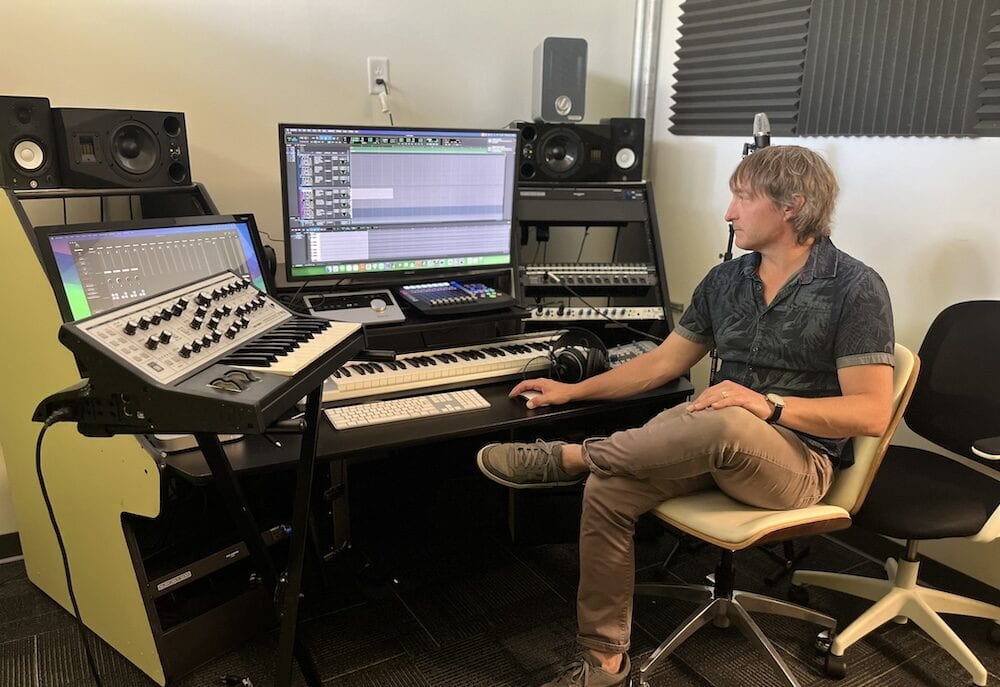 Man in control room of recording studio