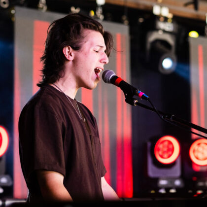 student musician singing live.