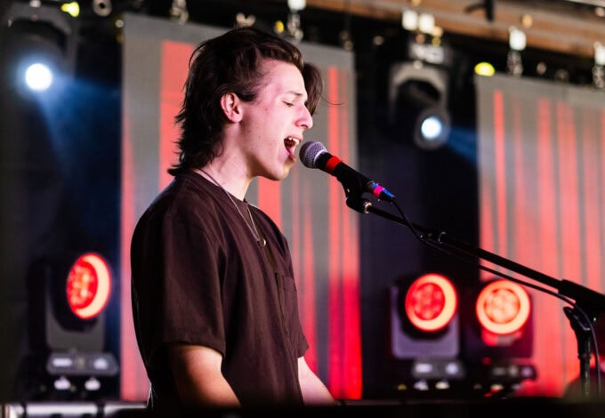 student musician singing live.