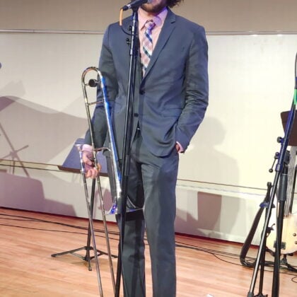 trombonist standing at mic